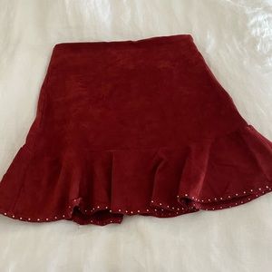 Deep reddish orange colored faux suede skirt
